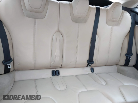 2013 Tesla Model S with VIN 5YJSA1CN8DFP21869, listed as a IAAI auction lot 41772603 with Not provided miles and . Bid and sale history available at DreamBid. Image 8.