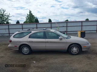 1998 Ford Taurus with VIN 1FAFP57U8WG275844, listed as a IAAI auction lot 42426107 with 318,654 mi miles and . Bid and sale history available at DreamBid. Image 13.