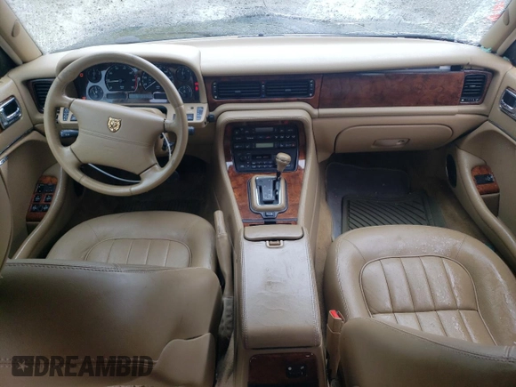 1997 Jaguar XJ with VIN SAJHX6248VC806189, listed as a Copart auction lot 57891035 with 51,654 mi miles and Salvage title. Bid and sale history available at DreamBid. Image 8.
