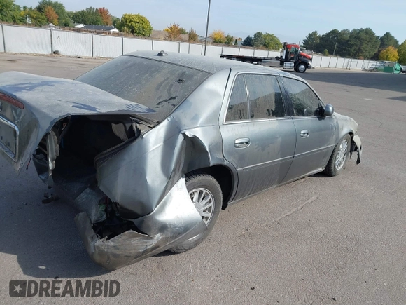 2004 Cadillac DeVille DHS z VIN 1G6KE57Y74U119605, wystawiony jako IAAI lot #40555057 z przebiegiem Nie podano mil oraz . Historia ofert i sprzedaży dostępna na DreamBid. Obrazek 4.