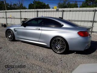 2015 BMW M4 with VIN WBS3R9C58FK334216, listed as a Copart auction lot 61497804 with 112,191 mi miles and Salvage Title. Bid and sale history available at carsss.com. Image 2.
