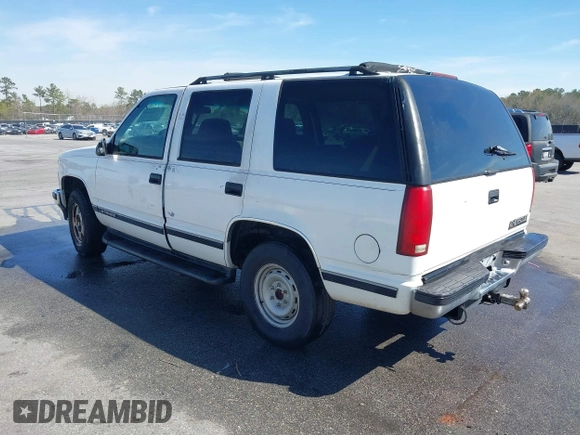 1999 Chevrolet Tahoe Z71 with VIN 1GNEK13R3XJ412067, listed as a IAAI auction lot 41789660 with 196,916 mi miles and . Bid and sale history available at DreamBid. Image 3.