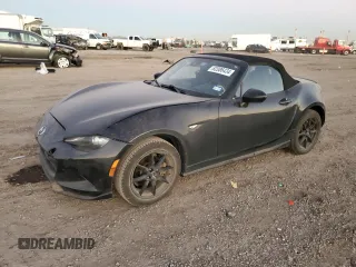 2021 Mazda MX-5 Miata Sport with VIN JM1NDAB79M0454876, listed as a Copart auction lot 82086434 with 74,035 mi miles and Salvage title. Bid and sale history available at DreamBid. Image 1.