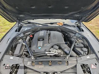 2012 BMW 7 Series 740i with VIN WBAKA4C52CC613791, listed as a Copart auction lot 82473894 with 132,656 mi miles and Clean Title. Bid and sale history available at carsss.com. Image 7.