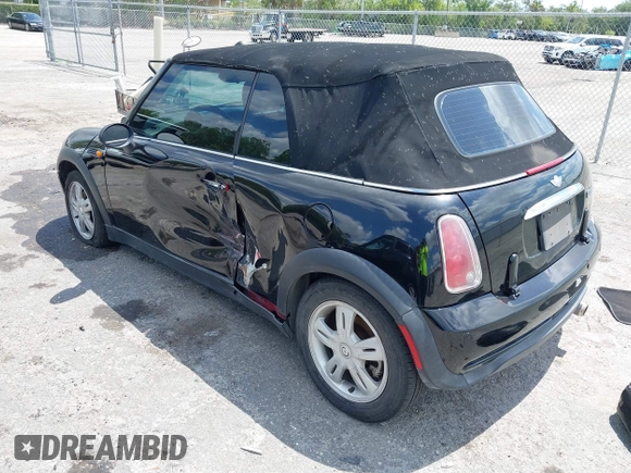 2006 MINI Convertible with VIN WMWRF33566TG15464, listed as a IAAI auction lot 42285777 with 144,430 mi miles and . Bid and sale history available at DreamBid. Image 3.