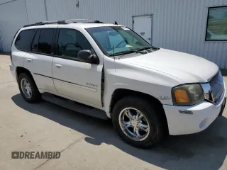 2006 GMC Envoy SLE z VIN 1GKDT13S762345183, wystawiony jako Copart lot #60096645 z przebiegiem 249 658 mil mil oraz Szkoda całkowita • Salvage title. Historia ofert i sprzedaży dostępna na DreamBid. Obrazek 4.
