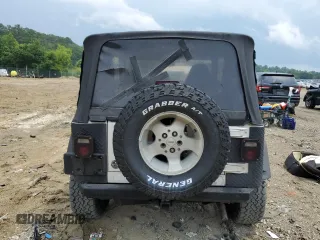 2000 Jeep Wrangler Sahara with VIN 1J4FA59SXYP760278, listed as a Copart auction lot 60402485 with 192,161 mi miles and Salvage title. Bid and sale history available at DreamBid. Image 6.