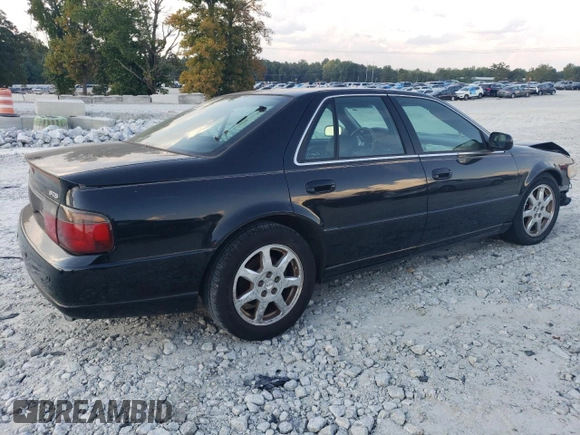 2001 Cadillac Seville Touring STS z VIN 1G6KY549X1U282930, wystawiony jako Copart lot #72750504 z przebiegiem Nie podano mil oraz Szkoda całkowita • Salvage title. Historia ofert i sprzedaży dostępna na DreamBid. Obrazek 3.