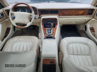 1996 Jaguar XJ with VIN SAJHX1741TC758740, listed as a Copart auction lot 73377914 with 140,964 mi miles and Salvage title. Bid and sale history available at DreamBid. Image 8.
