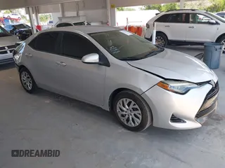2018 Toyota Corolla L z VIN 5YFBURHE4JP779721, wystawiony jako IAAI lot #42528083 z przebiegiem 72 999 mil mil oraz . Historia ofert i sprzedaży dostępna na DreamBid. Obrazek 1.