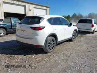2018 Mazda CX-5 Grand Touring with VIN JM3KFADM0J0377026, listed as a IAAI auction lot 41649686 with 100,901 mi miles and . Bid and sale history available at DreamBid. Image 4.
