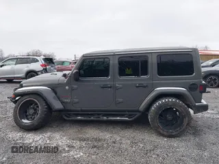 2019 Jeep Wrangler Unlimited Sahara with VIN 1C4HJXEG8KW533339, listed as a IAAI auction lot 40963653 with 69,202 mi miles and . Bid and sale history available at DreamBid. Image 14.