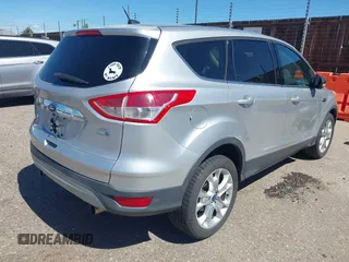 2013 Ford Escape SEL with VIN 1FMCU9HX0DUD42081, listed as a IAAI auction lot 42293456 with 100,013 mi miles and . Bid and sale history available at DreamBid. Image 4.