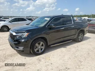 2022 Honda Ridgeline RTL-E with VIN 5FPYK3F7XNB002065, listed as a Copart auction lot 62134335 with 73,934 mi miles and Salvage title. Bid and sale history available at DreamBid. Image 1.