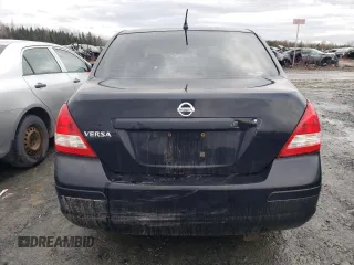 2009 Nissan Versa 1.6 z VIN 3N1CC11E09L468737, wystawiony jako Copart lot #51859825 z przebiegiem Nie podano mil oraz Nie do naprawy. Historia ofert i sprzedaży dostępna na DreamBid. Obrazek 6.
