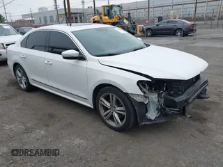 2015 Volkswagen Passat 1.8T SE w/Sunroof & Nav with VIN 1VWBT7A31FC043798, listed as a IAAI auction lot 42108289 with 132,442 mi miles. Bid and sale history available at carsss.com. Image 1.