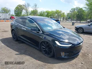 2019 Tesla Model X 75D with VIN 5YJXCBE21KF180203, listed as a IAAI auction lot 42190255 with 114,294 mi miles and . Bid and sale history available at carsss.com. Image 1.