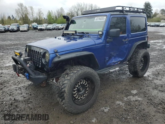 2009 Jeep Wrangler X with VIN 1J4FA24179L700884, listed as a Copart auction lot 52194055 with 96,189 mi miles and Salvage Title. Bid and sale history available at DreamBid. Image 1.