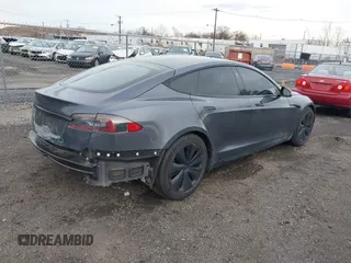 2021 Tesla Model S Long Range with VIN 5YJSA1E51MF440929, listed as a IAAI auction lot 41144902 with Not provided miles and . Bid and sale history available at DreamBid. Image 4.