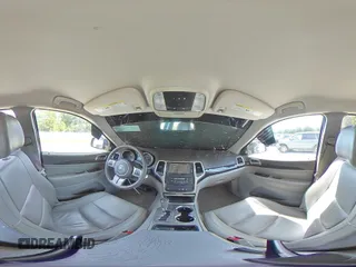 2013 Jeep Grand Cherokee Laredo with VIN 1C4RJEAG2DC519570, listed as a Copart auction lot 52066225 with 129,091 mi miles and Salvage Title. Bid and sale history available at carsss.com. Image 16.