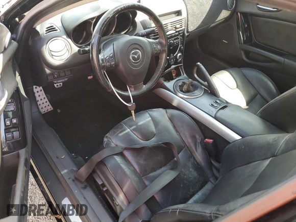 2006 Mazda RX-8 z VIN JM1FE173260200422, wystawiony jako Copart lot #69489204 z przebiegiem Nie podano mil oraz Nie do naprawy • Non repairable. Historia ofert i sprzedaży dostępna na DreamBid. Obrazek 8.