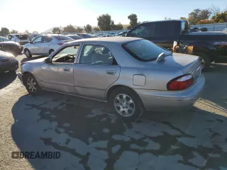 2002 Mazda 626 LX with VIN 1YVGF22C125297148, listed as a Copart auction lot 79130024 with 138,408 mi miles and Salvage Title. Bid and sale history available at carsss.com. Image 2.