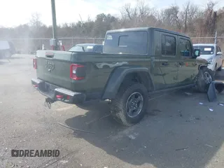 2023 Jeep Gladiator Rubicon with VIN 1C6JJTBGXPL586154, listed as a IAAI auction lot 41370352 with 11,207 mi miles and . Bid and sale history available at DreamBid. Image 4.