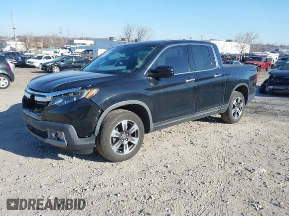 2019 Honda Ridgeline RTL-E with VIN 5FPYK3F7XKB033652, listed as a IAAI auction lot 41751421 with 96,774 mi miles and . Bid and sale history available at DreamBid. Image 16.