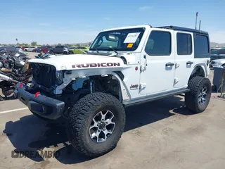 2021 Jeep Wrangler Unlimited Rubicon with VIN 1C4HJXFGXMW850556, listed as a IAAI auction lot 42234282 with 80,834 mi miles and . Bid and sale history available at DreamBid. Image 2.
