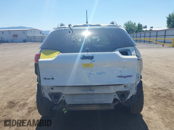 2014 Jeep Cherokee Trailhawk with VIN 1C4PJMBSXEW236807, listed as a IAAI auction lot 42660980 with 157,225 mi miles and . Bid and sale history available at DreamBid. Image 17.