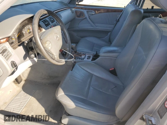 2000 Mercedes-Benz E-Class with VIN WDBJF65J3YB167247, listed as a Copart auction lot 75715464 with 0 mi miles and Salvage Title. Bid and sale history available at carsss.com. Image 7.