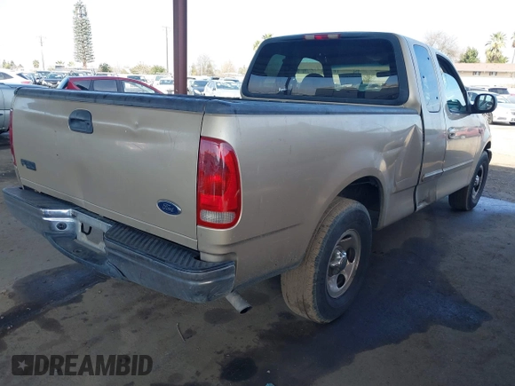 2000 Ford F-150 XL with VIN 1FTZX1723YKB48613, listed as a IAAI auction lot 41611851 with 187,450 mi miles. Bid and sale history available at carsss.com. Image 4.
