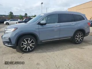 2022 Honda Pilot Touring 7-Passenger z VIN 5FNYF5H69NB031540, wystawiony jako Copart lot #51661185 z przebiegiem 58 316 mil mil oraz Szkoda całkowita • Salvage title. Historia ofert i sprzedaży dostępna na DreamBid. Obrazek 1.