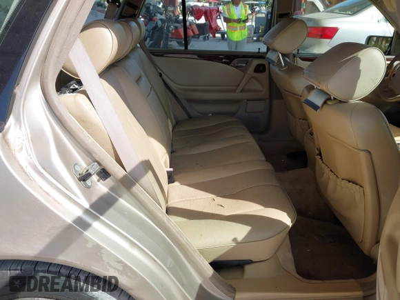 1999 Mercedes-Benz E-Class with VIN WDBJH65F3XA845635, listed as a IAAI auction lot 42102122 with 215,678 mi miles. Bid and sale history available at carsss.com. Image 8.