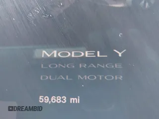2022 Tesla Model Y Long Range z VIN 7SAYGDEE6NF451259, wystawiony jako IAAI lot #41200775 z przebiegiem 59 683 mil mil oraz . Historia ofert i sprzedaży dostępna na DreamBid. Obrazek 16.