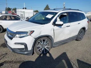 2021 Honda Pilot Touring 8-Passenger with VIN 5FNYF6H92MB031782, listed as a IAAI auction lot 42087322 with 70,062 mi miles and . Bid and sale history available at DreamBid. Image 2.
