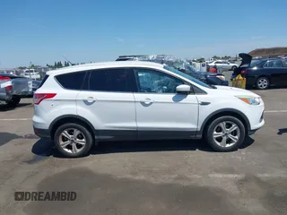 2015 Ford Escape SE z VIN 1FMCU0GX9FUA62790, wystawiony jako IAAI lot #42475851 z przebiegiem 135 697 mil mil oraz . Historia ofert i sprzedaży dostępna na DreamBid. Obrazek 14.