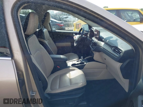 2020 Ford Escape Titanium z VIN 1FMCU9J92LUB48243, wystawiony jako IAAI lot #42143038 z przebiegiem 63 172 mil mil oraz . Historia ofert i sprzedaży dostępna na DreamBid. Obrazek 5.