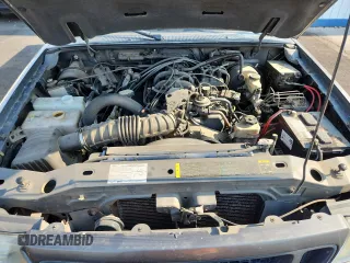 2005 Ford Ranger XLT z VIN 1FTZR45E05PA33894, wystawiony jako Copart lot #65205595 z przebiegiem 154 807 mil mil oraz Czysty tytuł • Clean title. Historia ofert i sprzedaży dostępna na DreamBid. Obrazek 11.