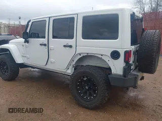 2014 Jeep Wrangler Unlimited Sahara z VIN 1C4BJWEG6EL245986, wystawiony jako IAAI lot #41498492 z przebiegiem 125 882 mil mil oraz . Historia ofert i sprzedaży dostępna na DreamBid. Obrazek 3.