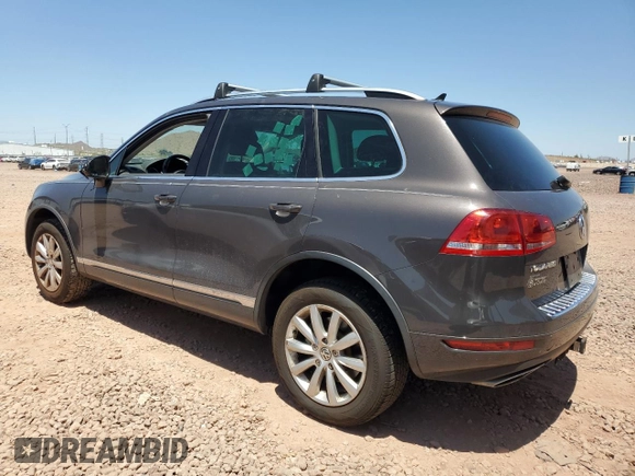 2012 Volkswagen Touareg Sport z VIN WVGFK9BPXCD003600, wystawiony jako Copart lot #61783705 z przebiegiem 171 598 mil mil oraz Czysty tytuł • Clean title. Historia ofert i sprzedaży dostępna na DreamBid. Obrazek 2.