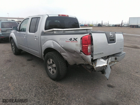 2011 Nissan Frontier PRO-4X with VIN 1N6AD0EV2BC438370, listed as a IAAI auction lot 41952484 with 217,529 mi miles. Bid and sale history available at carsss.com. Image 3.