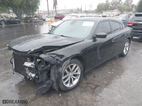 2015 Dodge Charger SXT with VIN 2C3CDXHG4FH768827, listed as a IAAI auction lot 41715030 with 117,485 mi miles. Bid and sale history available at carsss.com. Image 2.
