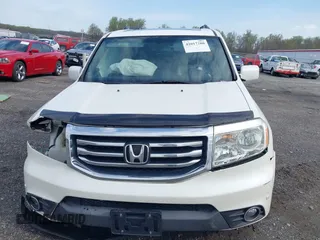 2014 Honda Pilot Touring with VIN 5FNYF4H97EB046879, listed as a IAAI auction lot 42017280 with 167,564 mi miles and . Bid and sale history available at carsss.com. Image 13.