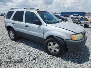 2003 Ford Escape XLT Popular with VIN 1FMYU03103KA06199, listed as a Copart auction lot 58731515 with 181,429 mi miles and Salvage title. Bid and sale history available at DreamBid. Image 4.