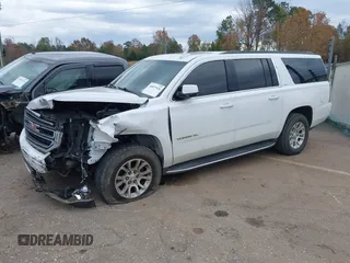 2019 GMC Yukon XL SLT with VIN 1GKS2GKC7KR165419, listed as a IAAI auction lot 40977930 with 167,195 mi miles and . Bid and sale history available at carsss.com. Image 2.