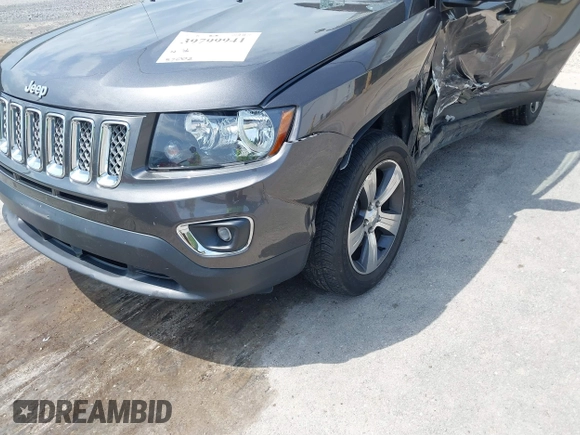 2016 Jeep Compass High Altitude Edition with VIN 1C4NJDEB0GD558230, listed as a IAAI auction lot 39799941 with 57,002 mi miles. Bid and sale history available at carsss.com. Image 14.