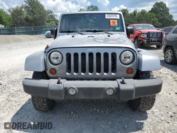2013 Jeep Wrangler Unlimited Sport with VIN 1C4BJWDG4DL628518, listed as a Copart auction lot 65029795 with 142,852 mi miles and Salvage title. Bid and sale history available at DreamBid. Image 5.