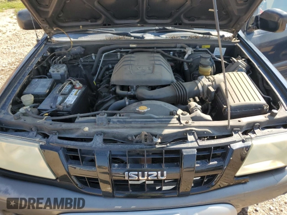 2003 Isuzu Rodeo with VIN 4S2CK58W634313617, listed as a Copart auction lot 70144664 with 179,921 mi miles and Clean Title. Bid and sale history available at DreamBid. Image 12.