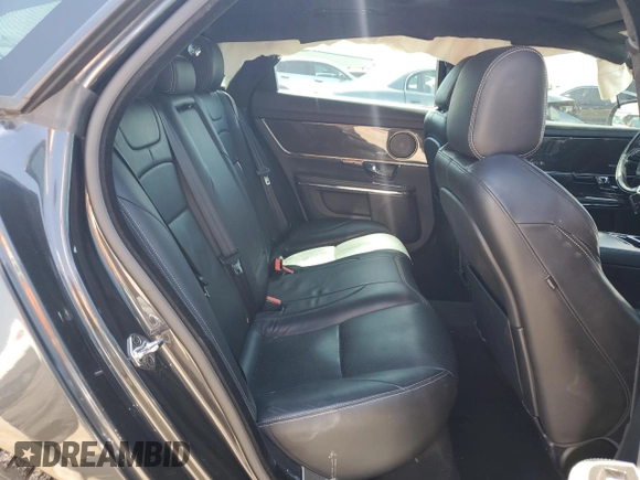 2013 Jaguar XJ with VIN SAJWA3HE9DMV49768, listed as a Copart auction lot 50339955 with 56,841 mi miles and Salvage Title. Bid and sale history available at DreamBid. Image 11.